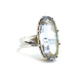 An 18ct white gold dress ring set oval pale blue stone within heart shaped mounts, ring size N, 6.
