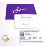A 9ct yellow gold Lehrer Tourus ring set serenite and small diamonds, ring size S, 2 gms,
