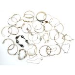 Thirty-three silver and metalware bangles and bracelets of varying designs,