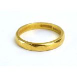 A 22ct yellow gold wedding band, maker ACCo., London 1954, band w. 2 mm, ring size N, 3.