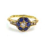 An Edwardian 18ct yellow gold cluster ring set six sapphires and eleven diamonds, maker L&I,