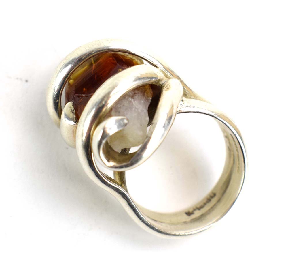 A late 20th century silver dress ring set amber coloured quartz within an entwined setting, - Image 5 of 7