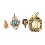 A small yellow metal cluster pendant set rectangular cut peach coloured stone within a border of