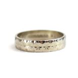 An 18ct white gold brightcut engraved wedding band, Birmingham 1964, ring size R 1/2, 4.