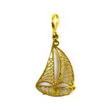 A Middle Eastern yellow metal filigree work pendant in the form of a sailing vessel, l. 4.4 cm, 2.