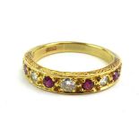 An 18ct yellow gold half eternity ring set five diamonds interspersed with four rubies within an