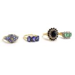 A 9ct yellow gold dress ring set pale blue stones and small diamonds in a flowerhead setting,
