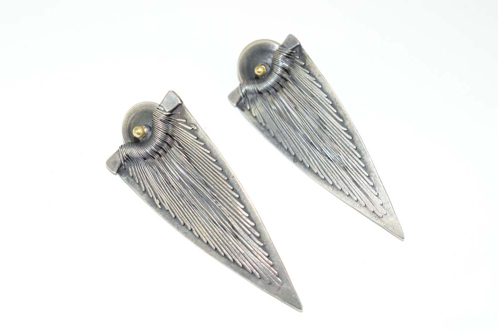 A pair of metalware wirework ear pendants of leaf shaped form, similar to a design by Wally Gilbert,