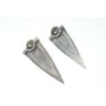 A pair of metalware wirework ear pendants of leaf shaped form, similar to a design by Wally Gilbert,