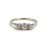 An early 20th century platinum ring set three graduated old cut diamonds,