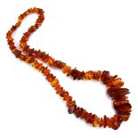 An amber-type graduated rough bead necklace, l.