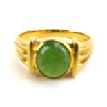 An 18ct yellow gold signet ring set cabochon green stone, ring size S 1/2, 6.