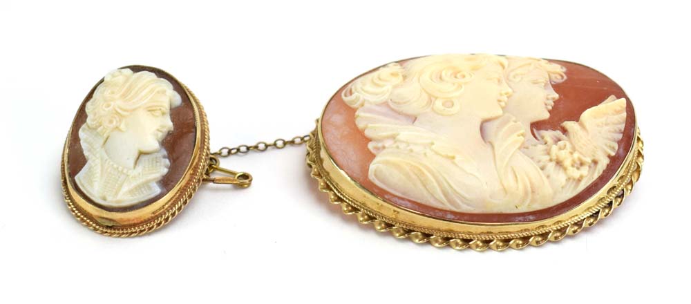 A 9ct yellow gold mounted cameo brooch of oval form depicting two females and a dove, w. 4.