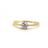 An 18ct yellow gold ring set old cut diamond in an eight claw setting, stone approximately 0.