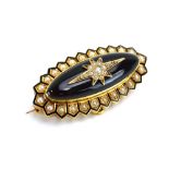 An early 20th century yellow metal mourning brooch of oval form set seed pearls in a recessed star