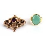 A yellow metal dress ring set oval cabochon turquoise within a rubover setting,