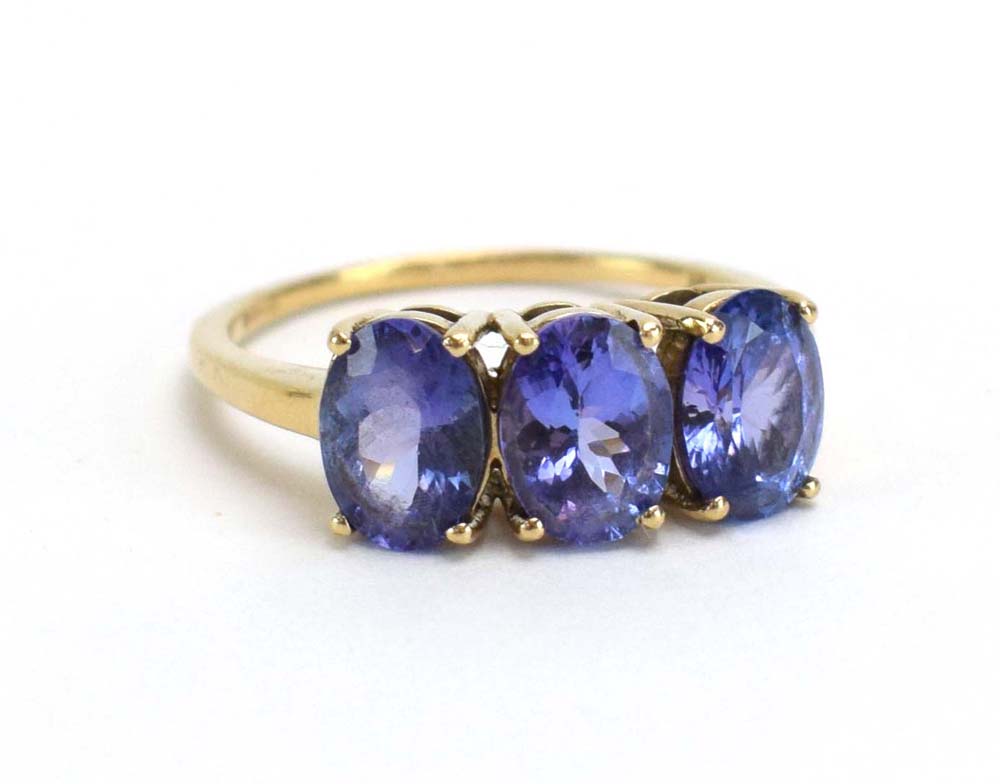 A 9ct yellow gold dress ring set pale blue stones and small diamonds in a flowerhead setting, - Image 9 of 12