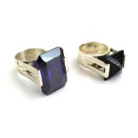 A late 20th century silver dress ring of imposing proportions set vivid purple glass in a raised