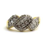 A 9ct yellow gold Tomas Rae ring set small diamonds in a twist setting,
