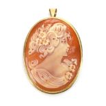 A 9ct yellow gold oval cameo pendant/brooch depicting a classical female, head and shoulders, l. 3.