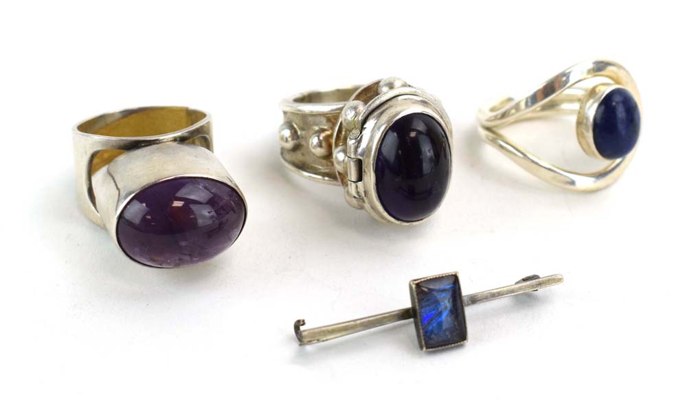 A late 20th century silver 'poison' ring set cabochon amethyst, maker PGW, London 1991,