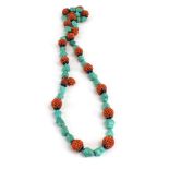 An early/mid 20th century single strand bead necklace set turquoise and coral within blue enamelled