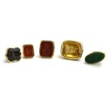 Five late 19th/early 20th century gold plated and yellow metal watch fobs set citrine and hardstone