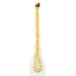A single strand graduated cultured pearl necklace with 9ct yellow gold clasp set small pearls and