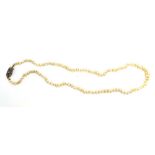 An early 20th century single strand slightly graduated natural pearl necklace with yellow metal and