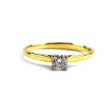 An 18ct yellow gold ring set brilliant cut diamond in a four claw setting, approximately 0.