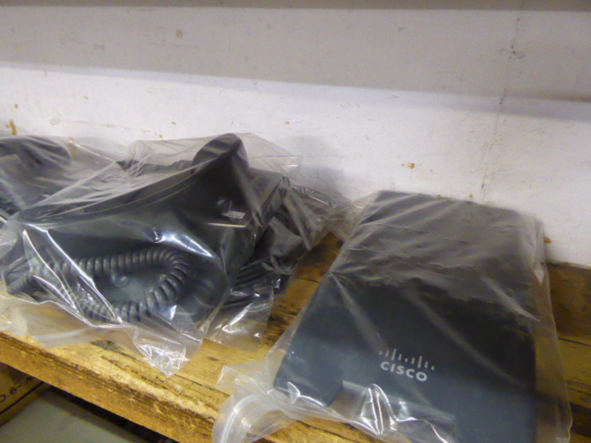 Box containing approximately 10 Cisco desk top office phones