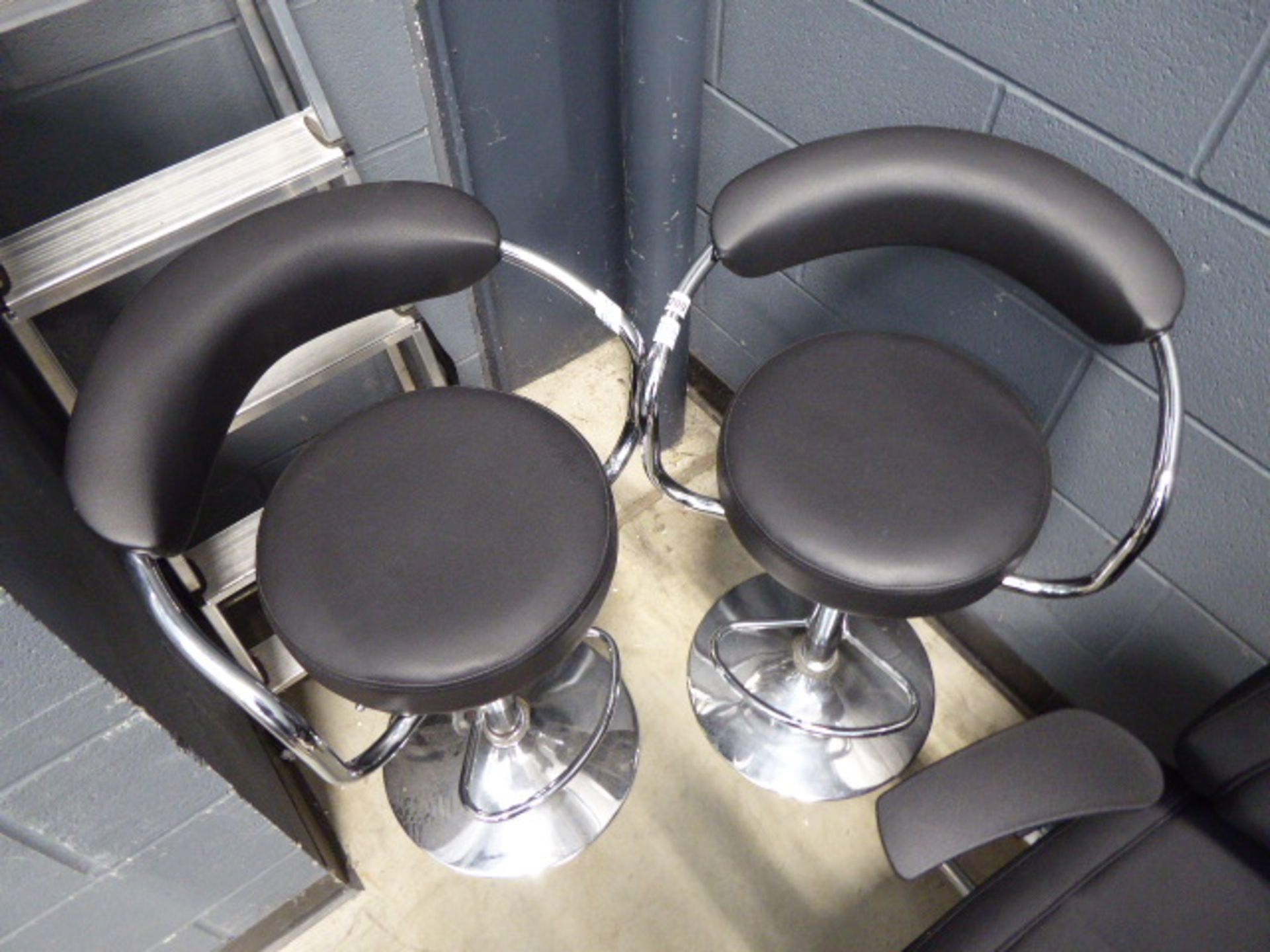 2 chrome framed bar stools