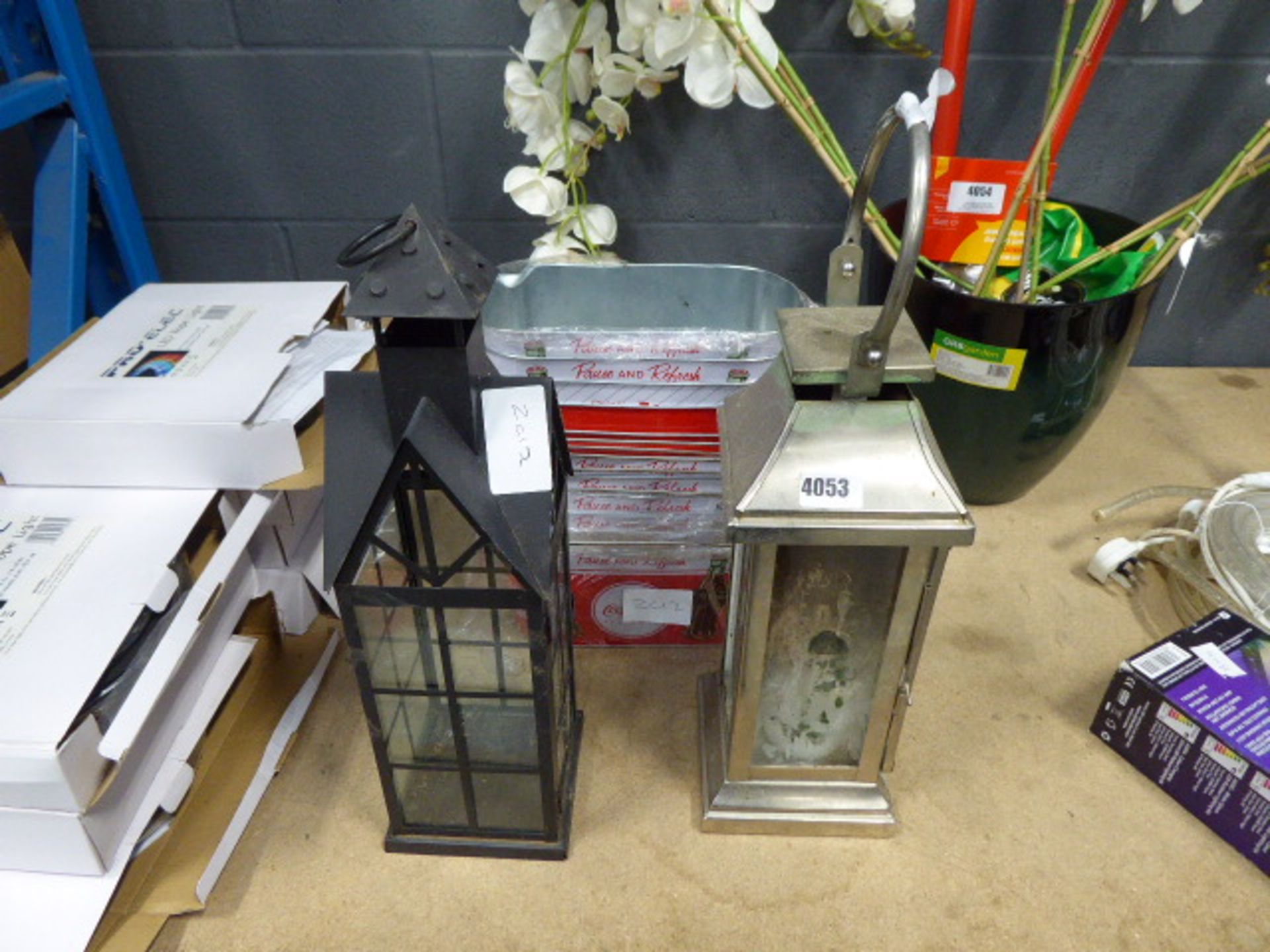 2 lanterns and some Coca-Cola tin tubs