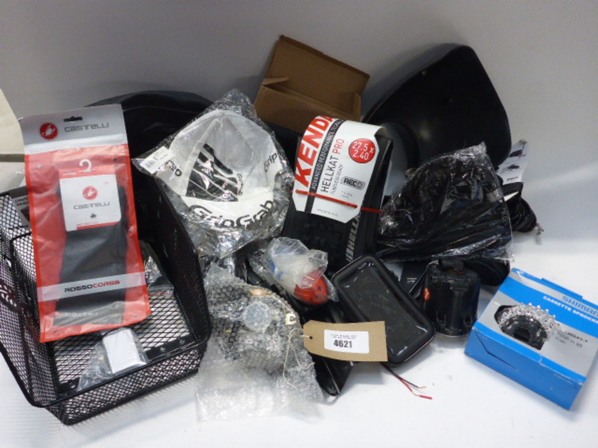 Bag containing bike and motorcycle parts, Shimano sprockets, tyres, hats, seat covers, lights etc