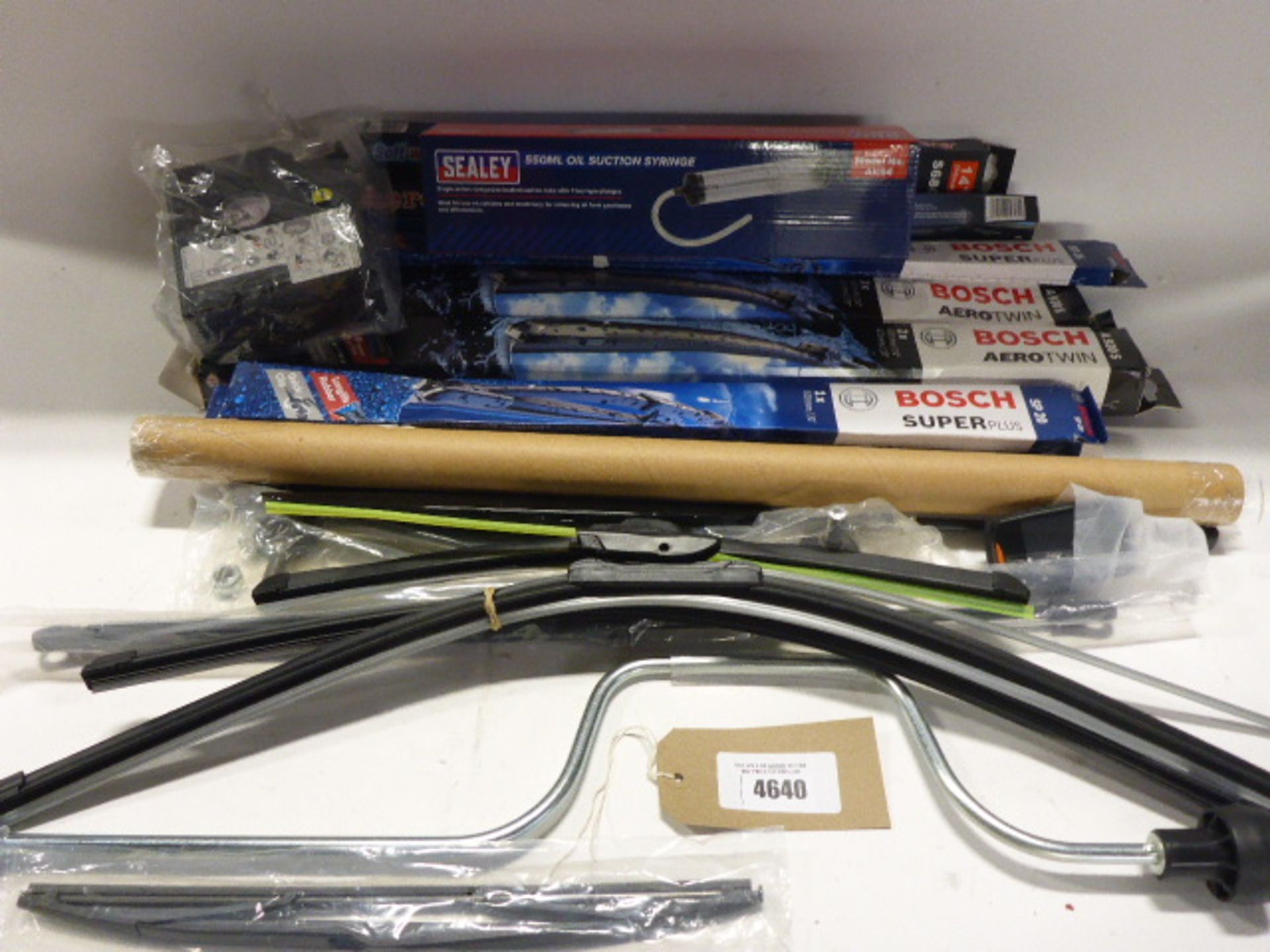 Bag containing wiper blades, oil suction syringe, winding handle, small compressor and struts