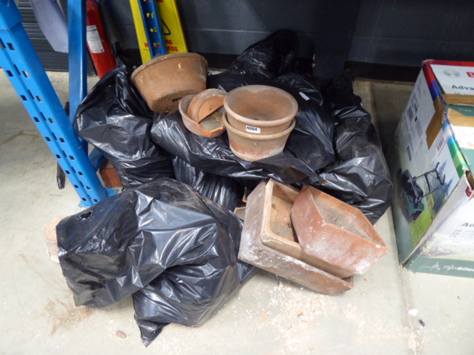 Large quantity of bagged and unbagged terracotta pots