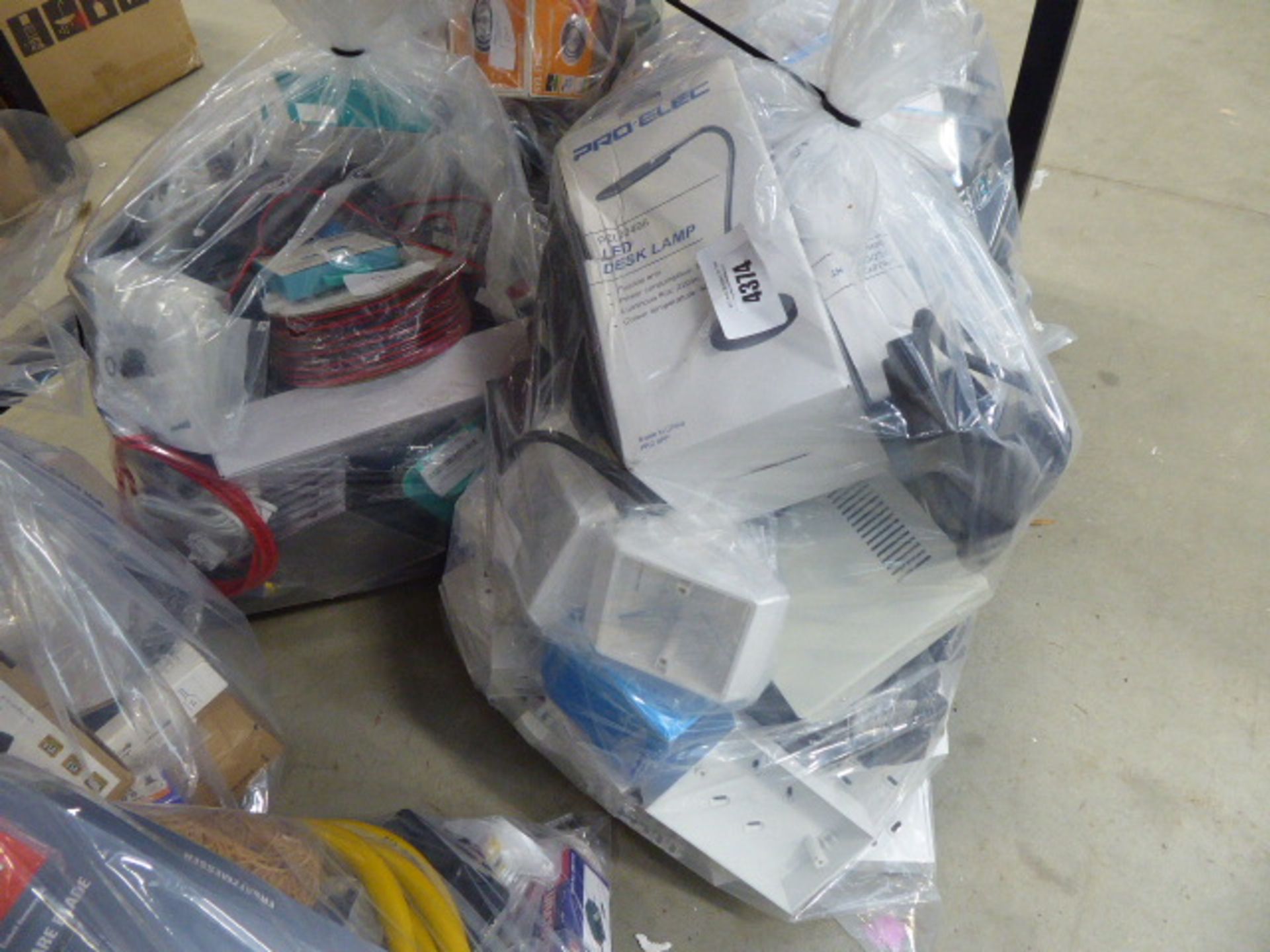 2 bags containing electric cables, CD cases, switch boxes, soldering station, extension leads etc