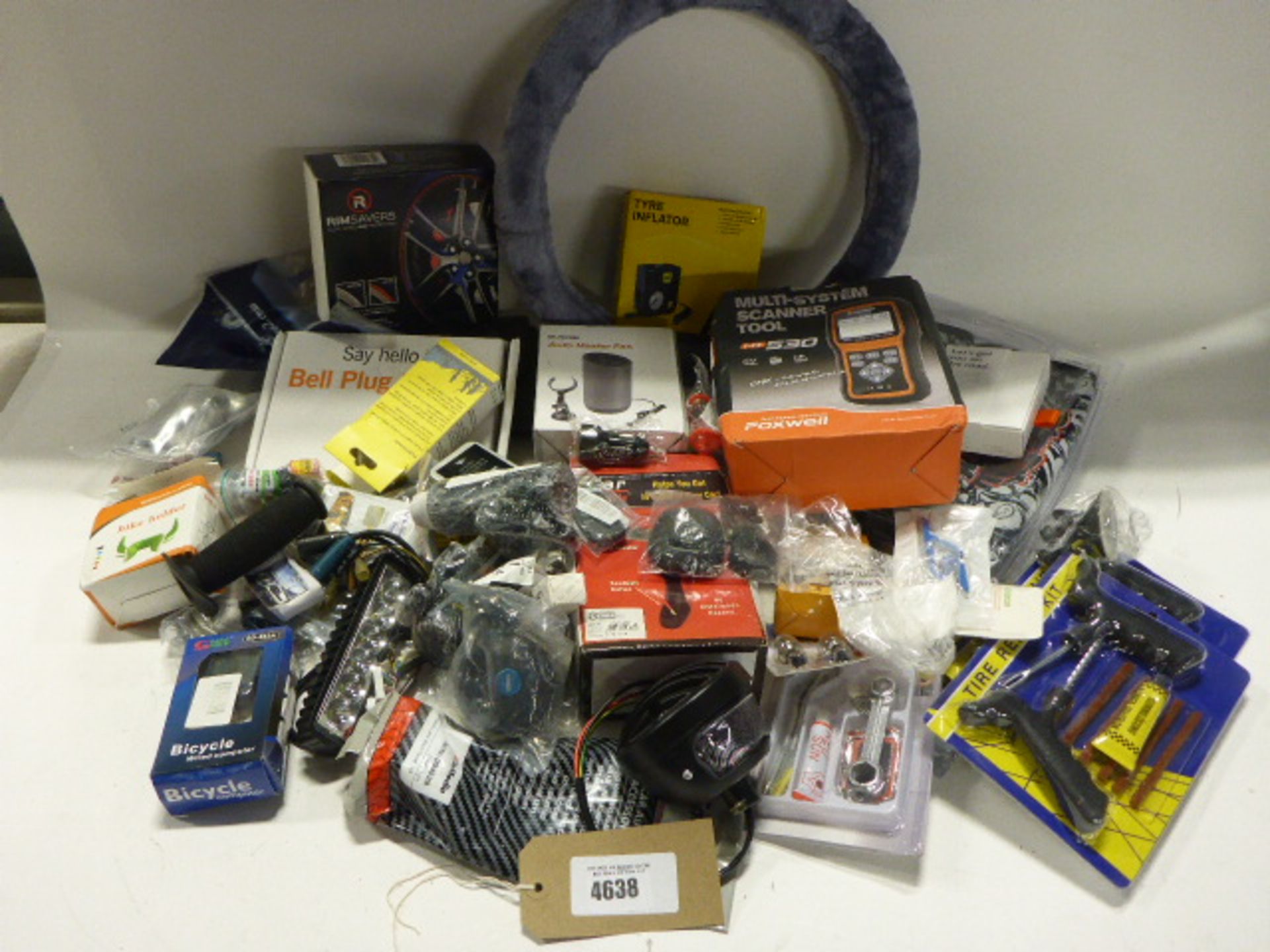 Bag containing lights, multi system scanning tools, steel wheel cover, tyre inflator, phone holders,