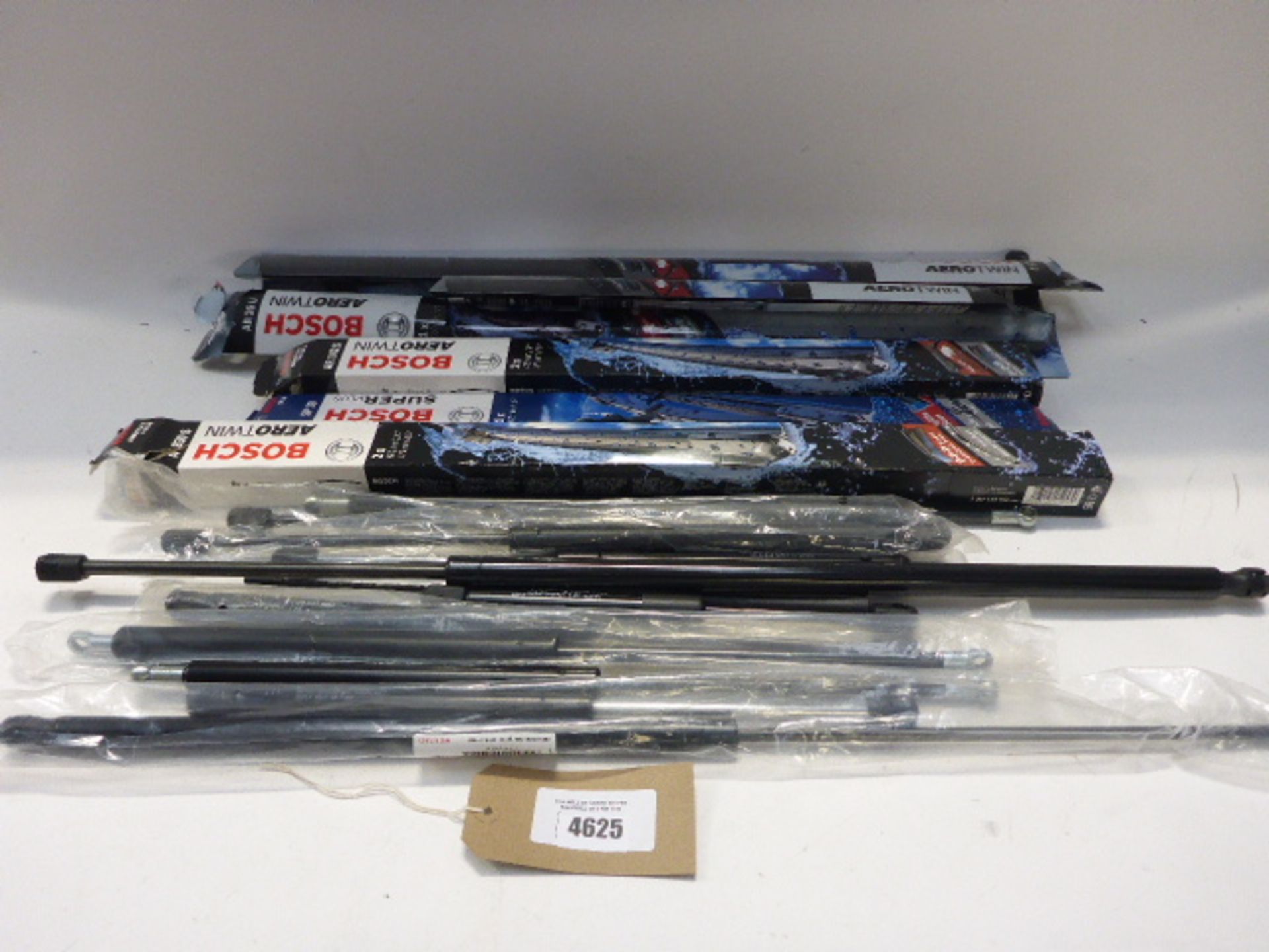 Bag containing Bosch and other wiper blades and car struts