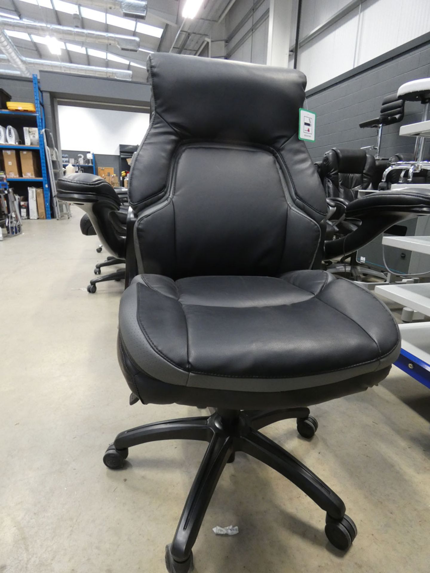 A black & grey high back executive style swivel armchair