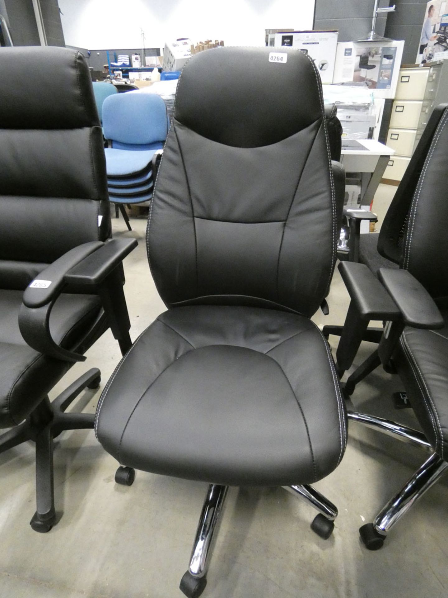 A black high back swivel armchair