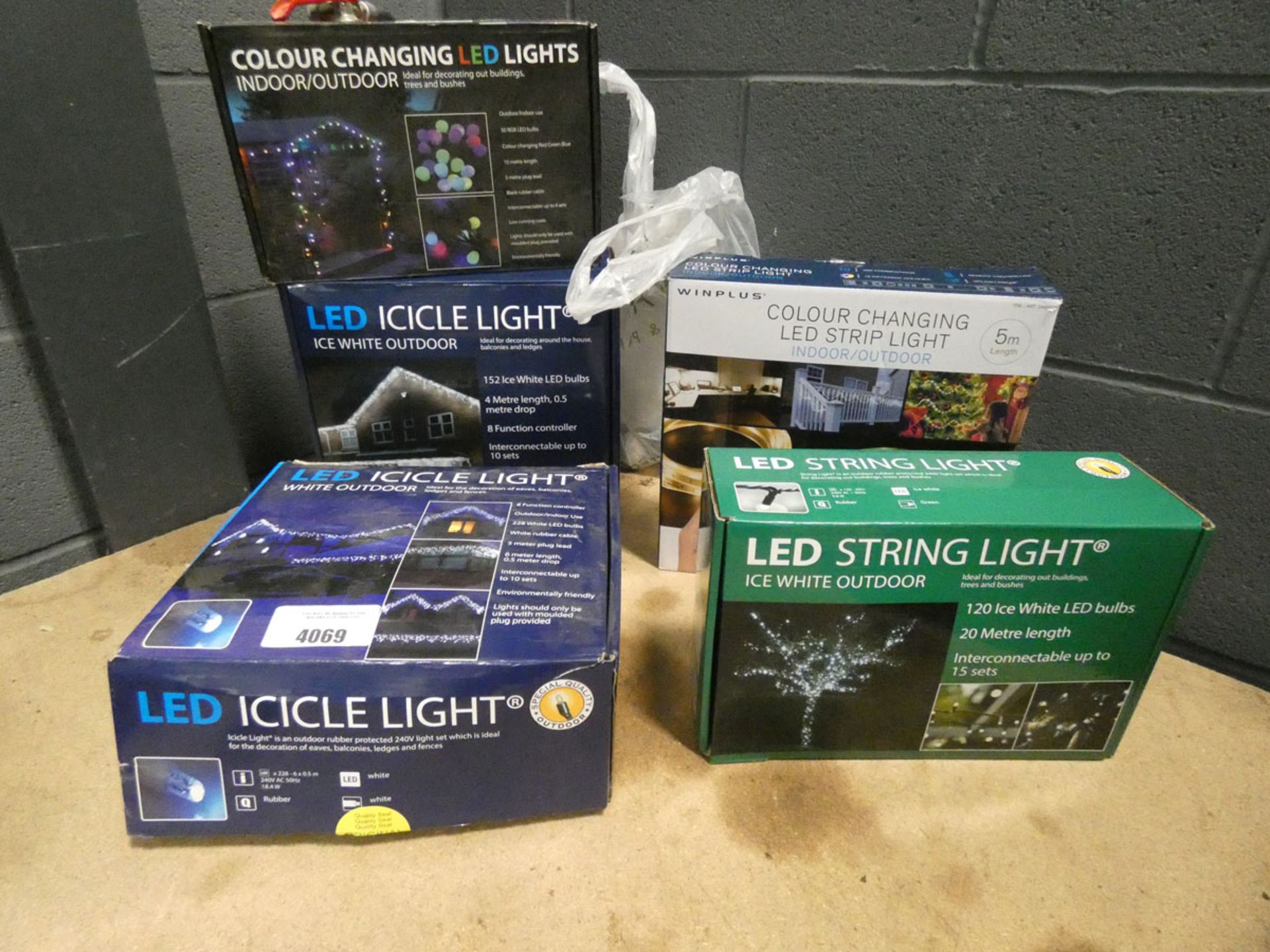 4 boxes of LED string lights and a colour changing strip light