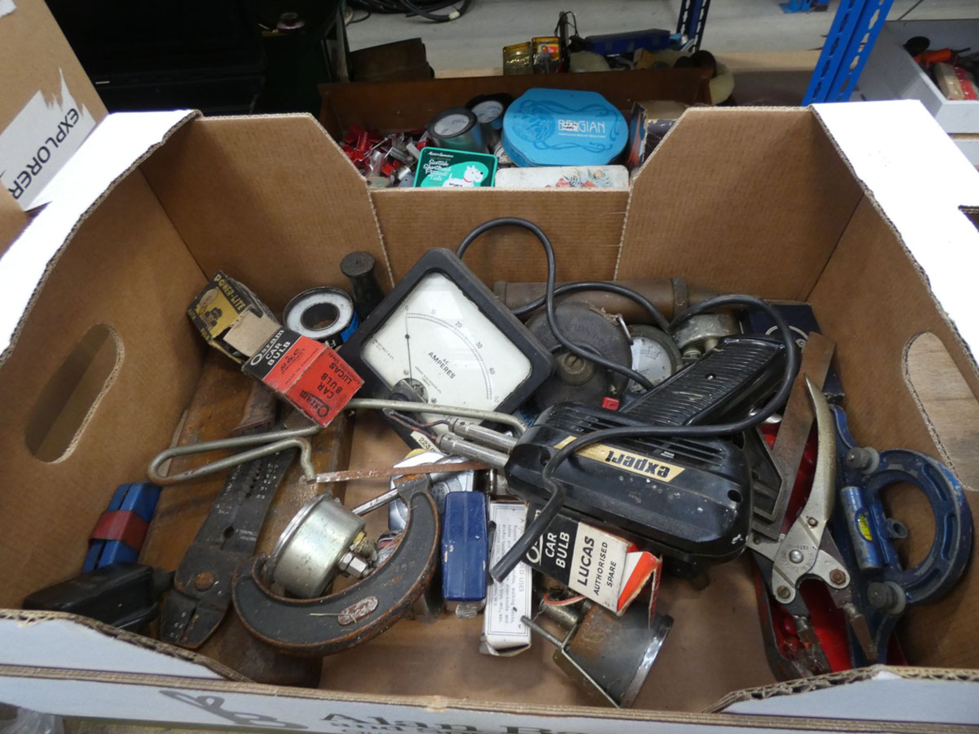 A box containing soldering iron, micrometers, gauges and other items