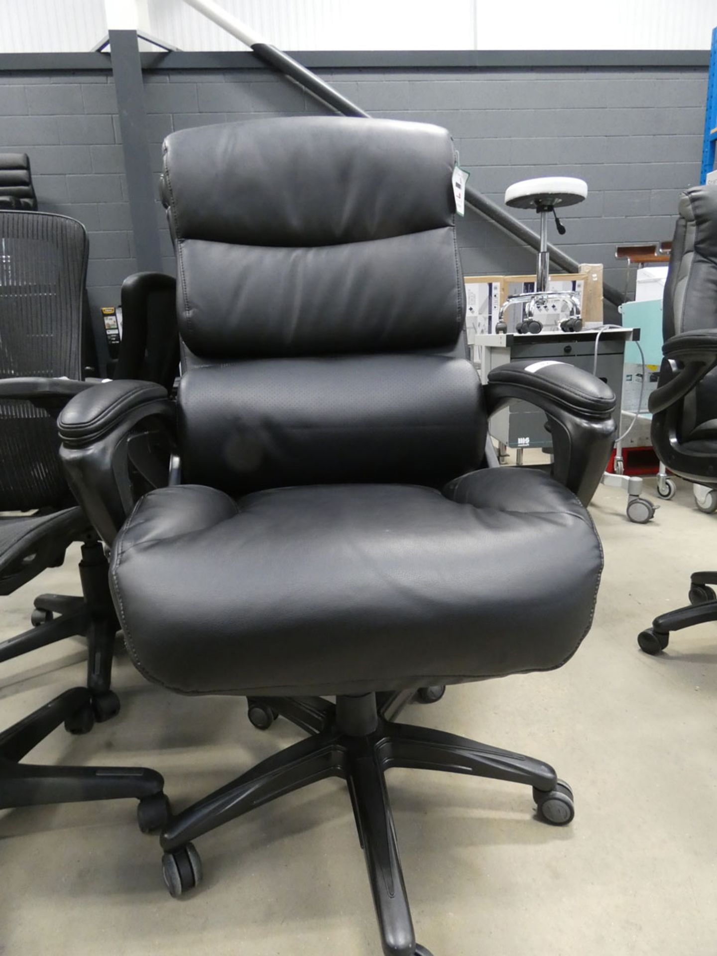 A back high back executive style swivel armchair