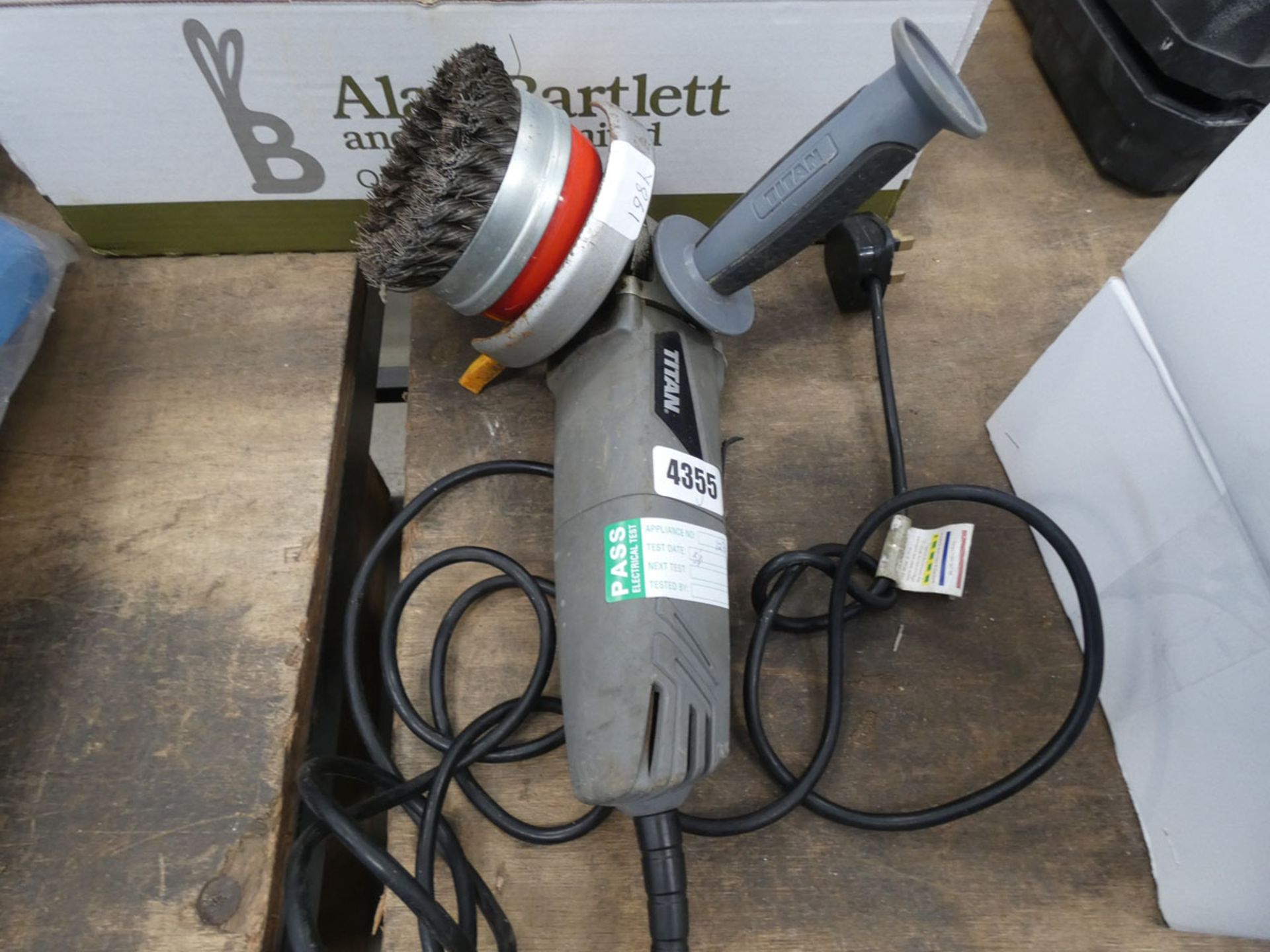 A Titan 3 1/2'' angle grinder with wire brush