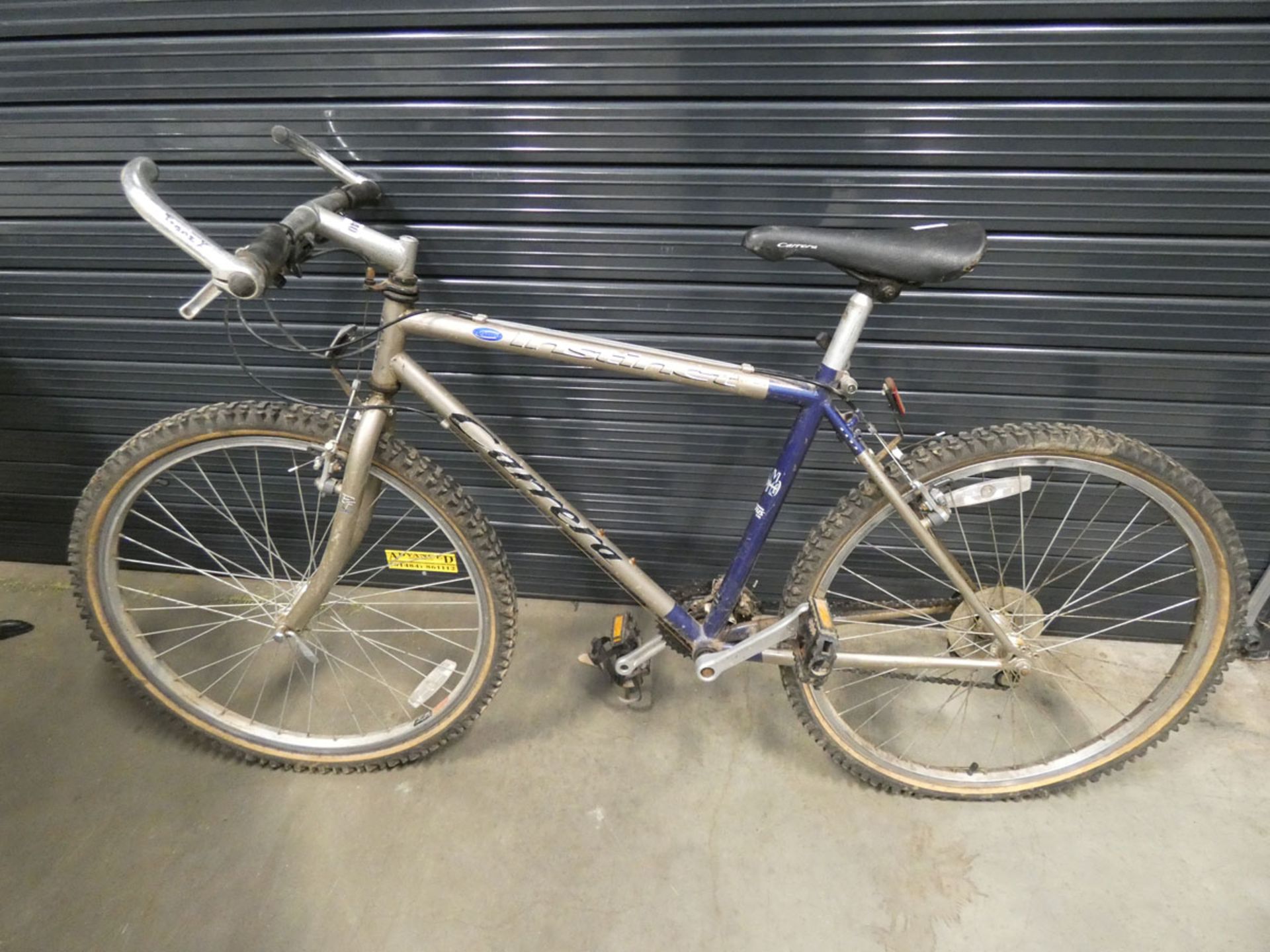 Carrera gold and blue gents mountain bike
