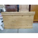 A stripped pine blanket box