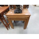 Nest of three teak tables