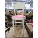 A white painted Thonet-style cafe chair