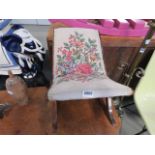 A floral embroidered gout stool